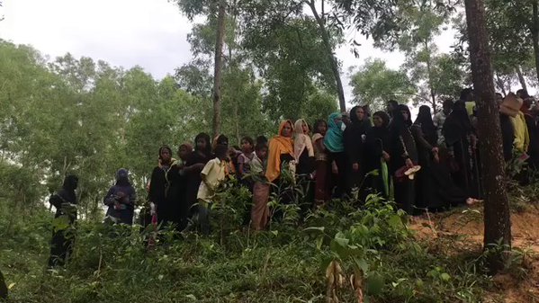 Unreal line for food as Rohingya queue at a distribution station in Kutupalong refugee camp, Bangladesh    