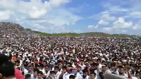 A Rohingya woman talks to these massive crowds of refugees in the Bangladeshi camps at the memorial for the attacks that forced most of their population into becoming refugees.   The UN has called those attacks genocidal