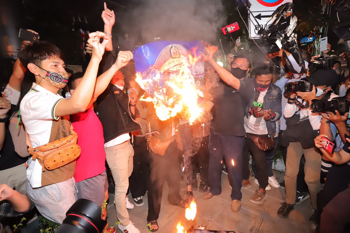 Demonstrators burn portrait of Burmese junta leader Min Aung Hlaing close to the Myanmar Embassy in Bangkok on Thursday night to protest the coup in Myanmar and call for restoration of democratic government