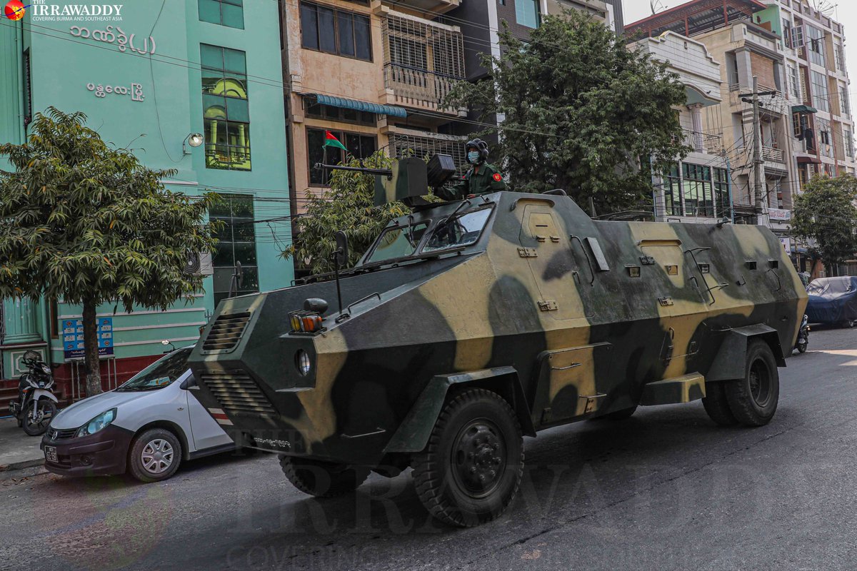 Anti_coup protesters filled the streets of Mandalay on Monday, standing in front of government offices and banks and urging staff to join the #CivilDisobedienceMovement, despite the presence of troops. (Photo: The Irrawaddy) 