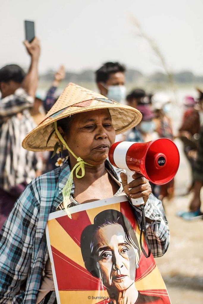Riot police blocked the entrance to the city of Monywa to disperse the protestor crowds but people protest in Chindwin River outside the city without taking a step back