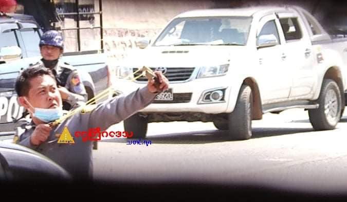 Police shooting the citizens with sling.  Location: Taunggyi, Myanmar 