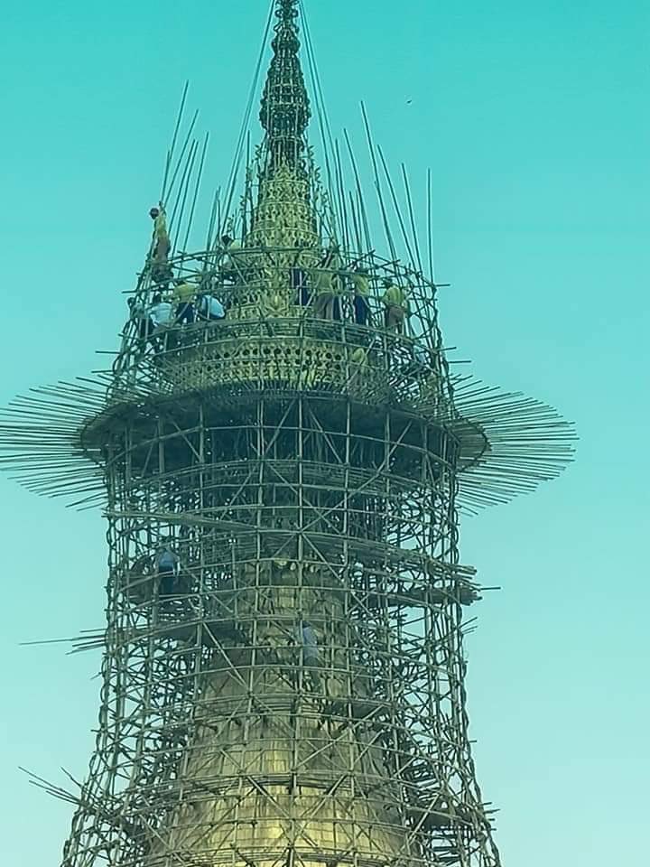Shwedagon Pagoda is scaffolding till holy umbrella which enshrined with many precious jewels . Locals who live near pagoda since they born says they had never seen scaffolding till holy umbrella before — photos are taken today (3.4.2021)