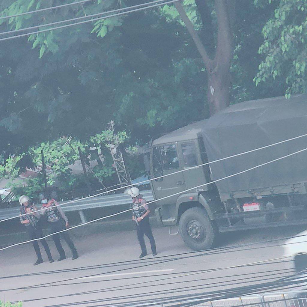 Soldiers and police are inspecting vehicles at a poultry market in Tamwe Township, Yangon